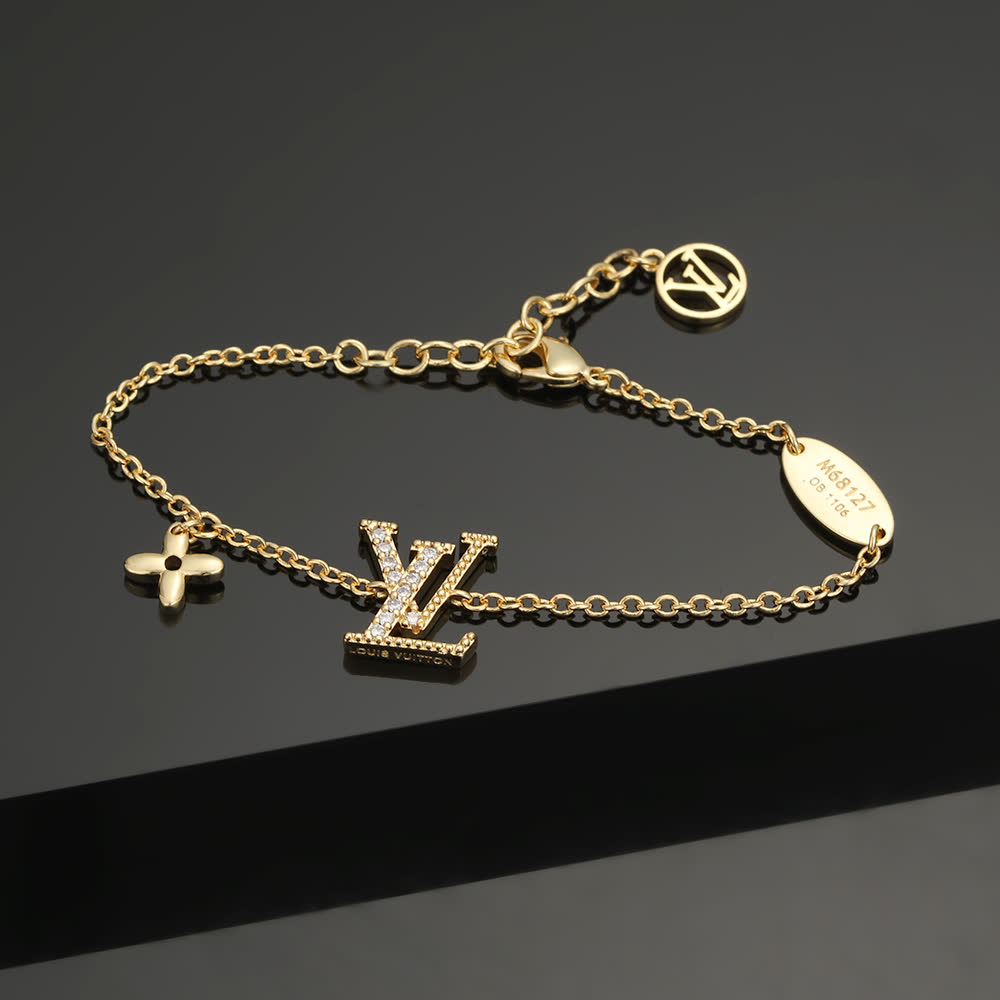 Louis Vuitton Gold Tone Bracelet with Monogram Charm
